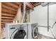 Basement laundry area with washer and dryer, and exposed ductwork and beams at 3049 E Long S Cir, Centennial, CO 80122