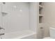 Bright bathroom showcasing a clean white bathtub and built-in shelves at 3049 E Long S Cir, Centennial, CO 80122