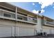 Townhome exterior featuring garages and balconies, in a neutral color palette at 3049 E Long S Cir, Centennial, CO 80122