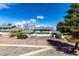 Wide shot of a townhome exterior highlighting garages and balconies at 3049 E Long S Cir, Centennial, CO 80122