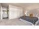 Spacious main bedroom with plush carpeting, a walk-in closet, and modern decor at 3049 E Long S Cir, Centennial, CO 80122