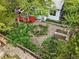 Aerial view of a charming house with a large backyard with rock garden and brickwork at 823 Timothy Dr, Longmont, CO 80503