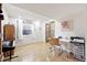Finished basement featuring hard wood floors, a work area, and natural light at 823 Timothy Dr, Longmont, CO 80503