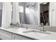 Dual sinks and marble vanity in a bright bathroom at 823 Timothy Dr, Longmont, CO 80503