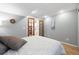 Bedroom with hardwood floors and natural light, with an ensuite bathroom at 823 Timothy Dr, Longmont, CO 80503