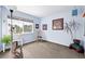 Bright bedroom with a large window providing natural light, complemented by light blue walls at 823 Timothy Dr, Longmont, CO 80503
