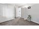 Bedroom features neutral carpet, closet and adjacent room at 823 Timothy Dr, Longmont, CO 80503