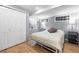 Basement bedroom with egress windows, double closet, and light gray walls for a serene ambiance at 823 Timothy Dr, Longmont, CO 80503