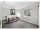 Large bedroom features a window and decorative wood chest at 823 Timothy Dr, Longmont, CO 80503