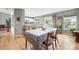 Open-concept dining area with hardwood floors, seamlessly connected to a modern kitchen at 823 Timothy Dr, Longmont, CO 80503