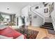 Bright living room with hardwood floors and a staircase leading to the second floor at 823 Timothy Dr, Longmont, CO 80503
