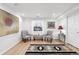 Cozy living room with hardwood floors, natural light, and tastefully decorated with neutral accents at 823 Timothy Dr, Longmont, CO 80503