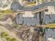 An aerial view of a well-maintained residential area featuring lush surroundings and tree-lined streets at 23753 E Kettle Pl, Aurora, CO 80016