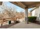 A covered back porch, complete with a stone pillar, offering relaxing outdoor space at 23753 E Kettle Pl, Aurora, CO 80016