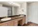 Bathroom featuring double sinks, vanity mirror, countertop, and a walk-in shower at 23753 E Kettle Pl, Aurora, CO 80016