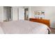 Bedroom featuring a queen size bed, carpet flooring and a wooden dresser at 23753 E Kettle Pl, Aurora, CO 80016