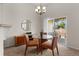 Cozy dining area with sliding doors, carpet flooring, and a stylish light fixture at 23753 E Kettle Pl, Aurora, CO 80016