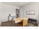 Bright home office features neutral walls, modern desk, and convenient bench seating at 23753 E Kettle Pl, Aurora, CO 80016