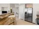 Open concept kitchen with tile floors, granite countertops, stainless steel appliances, and lots of storage space at 23753 E Kettle Pl, Aurora, CO 80016