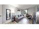 This bedroom has a sofa, mirror, office chair, desk, and decoratively painted wall at 491 S Kalispell Way # 305, Aurora, CO 80017