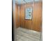 An elevator with wood grain paneling and a gray laminate floor at 491 S Kalispell Way # 305, Aurora, CO 80017