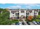 Well-maintained building exterior with tidy landscaping and ample parking at 491 S Kalispell Way # 305, Aurora, CO 80017