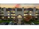 Lovely building exterior view showcasing balconies and landscaped grounds during sunset at 491 S Kalispell Way # 305, Aurora, CO 80017