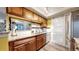 Charming kitchen with granite countertops, updated appliances, and a stylish sliding pantry door at 491 S Kalispell Way # 305, Aurora, CO 80017