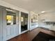 A well-lit entryway with red brick flooring, mailboxes, and a secured entry at 491 S Kalispell Way # 305, Aurora, CO 80017