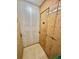 Individual storage unit featuring plywood door and a concrete wall at 491 S Kalispell Way # 305, Aurora, CO 80017