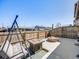 Backyard with outdoor seating, a built-in fire pit, perfect for entertaining guests at 246 Ash St, Bennett, CO 80102