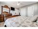 Bedroom boasting a TV and ample closet space for storage convenience at 246 Ash St, Bennett, CO 80102