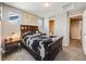 Comfortable bedroom featuring ample light, a queen-sized bed and clean carpet at 246 Ash St, Bennett, CO 80102