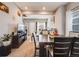 Inviting dining area with an open floor plan and neutral decor throughout at 246 Ash St, Bennett, CO 80102