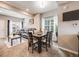 Cozy living room with carpet, featuring an open floor plan and an adjacent dining area at 246 Ash St, Bennett, CO 80102