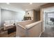 Upstairs loft featuring a comfortable seating area and access to additional rooms at 246 Ash St, Bennett, CO 80102