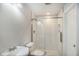 Modern bathroom features subway tile shower, glass door, and white sink and toilet at 1018 Mcmurdo Cir, Castle Rock, CO 80108
