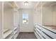 Spacious walk-in closet with built-in shelving, drawers, and a window for natural light at 1018 Mcmurdo Cir, Castle Rock, CO 80108