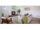 Cozy living room featuring a modern fireplace, neutral decor, and comfortable seating at 1018 Mcmurdo Cir, Castle Rock, CO 80108