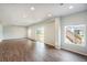 Bright open living area with hardwood floors, recessed lighting, and a sliding glass door to the backyard at 1018 Mcmurdo Cir, Castle Rock, CO 80108