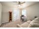 Bedroom with sofa, desk, and wood cabinet at 5482 Wetlands Dr, Frederick, CO 80504