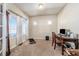 Bright home office with built-in shelving and large windows at 5482 Wetlands Dr, Frederick, CO 80504