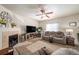 Living room with fireplace and a comfortable couch at 5482 Wetlands Dr, Frederick, CO 80504