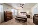 Main bedroom with king-size bed and large dresser at 5482 Wetlands Dr, Frederick, CO 80504