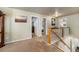 Upstairs hallway with carpet, doors to bedrooms, and a staircase at 5482 Wetlands Dr, Frederick, CO 80504