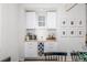 Built in bar area features a wine rack, storage cabinets, and wood countertop at 3433 N Wabash St, Denver, CO 80238