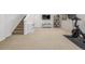 Spacious finished basement featuring neutral carpet, recessed lighting, and exercise equipment at 3433 N Wabash St, Denver, CO 80238
