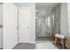 Modern bathroom with glass-enclosed shower and neutral tile at 3433 N Wabash St, Denver, CO 80238