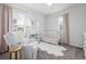Charming Bedroom with a white crib, rocker, and soft pink accents at 3433 N Wabash St, Denver, CO 80238