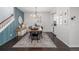 Dining room with stylish lighting and an adjacent beverage center at 3433 N Wabash St, Denver, CO 80238